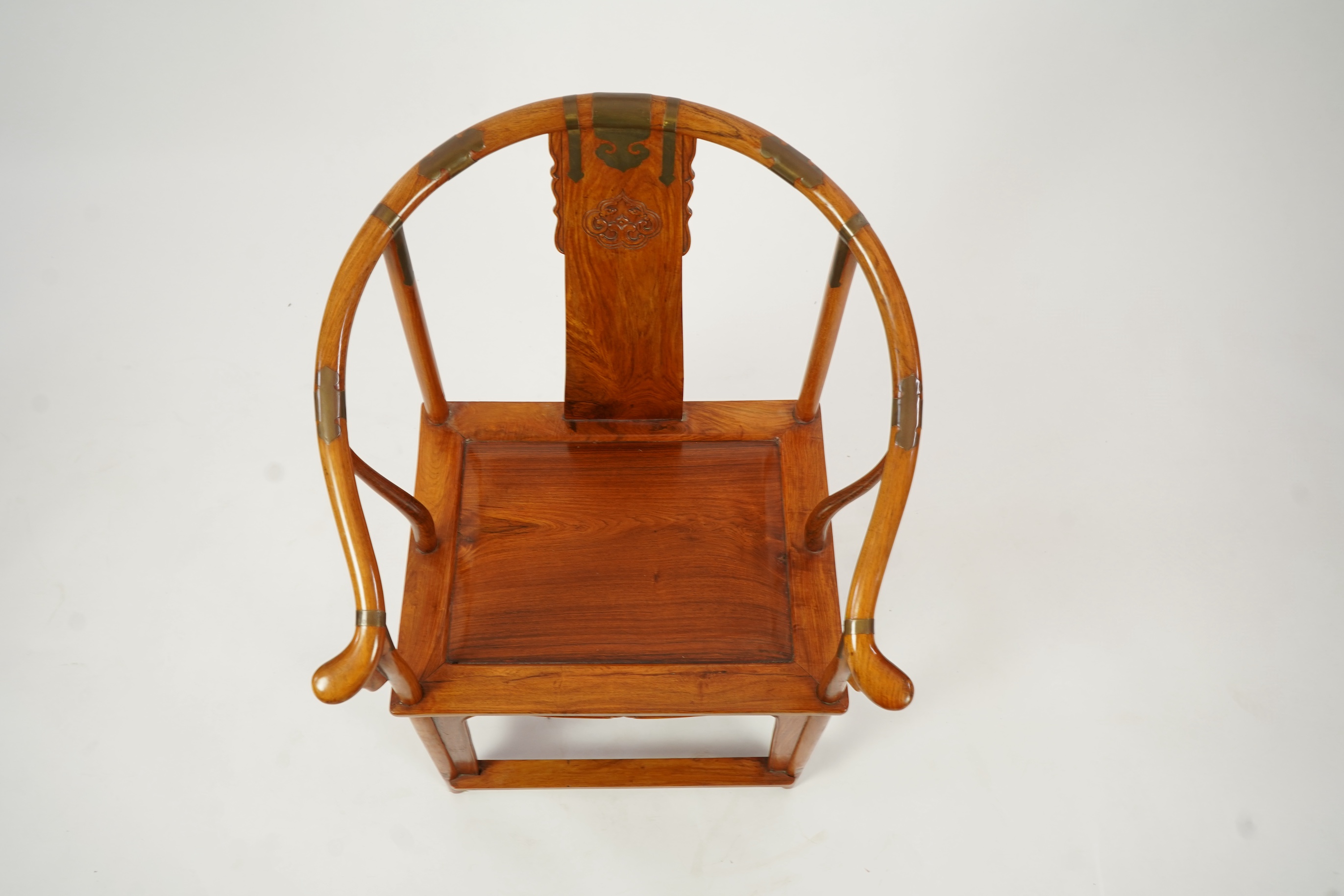 A Chinese huanghuali and brass mounted horseshoe-back armchair, quanyi, late 19th century